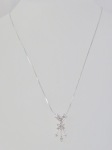 Flower Pendant with Round & Baguette Diamonds